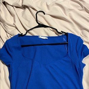 Blue bodysuit. Never worn; buttons at the bottom